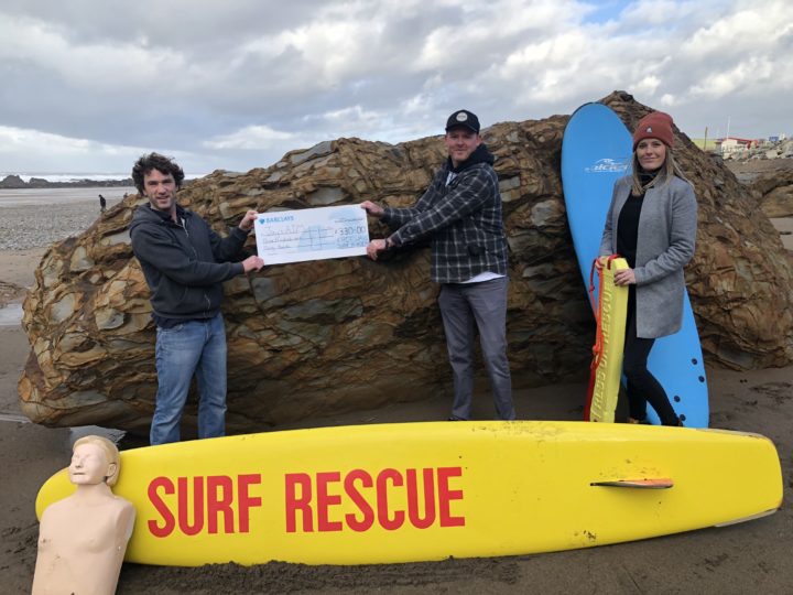 Robin at Freewave Surf Academy presenting Jays AIM with a cheque